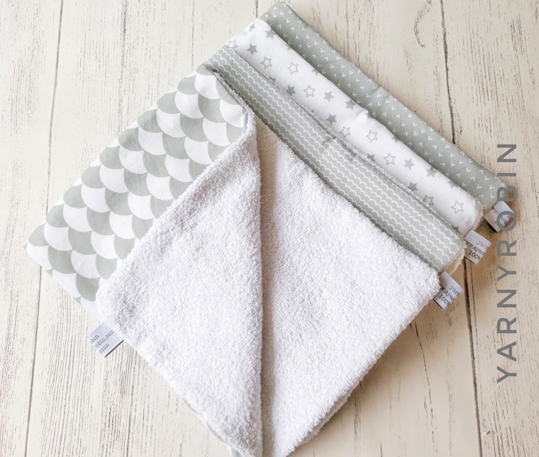 grey and white burp cloths