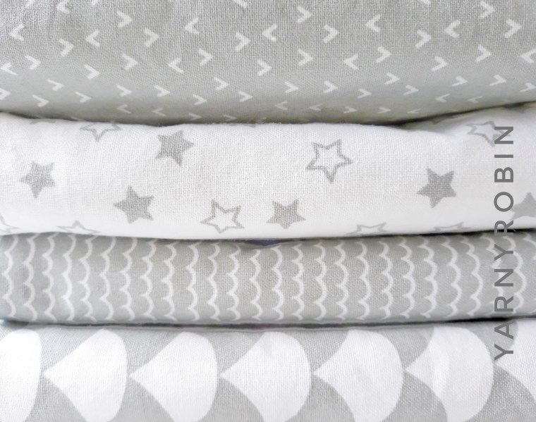 grey and white burp cloths